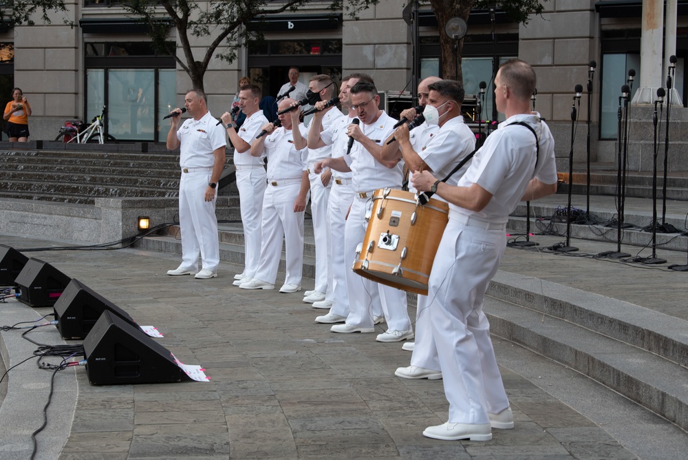 U.S. Navy Band Sea Chanters Chorus performs at the U.S. Navy Memorial Plaza