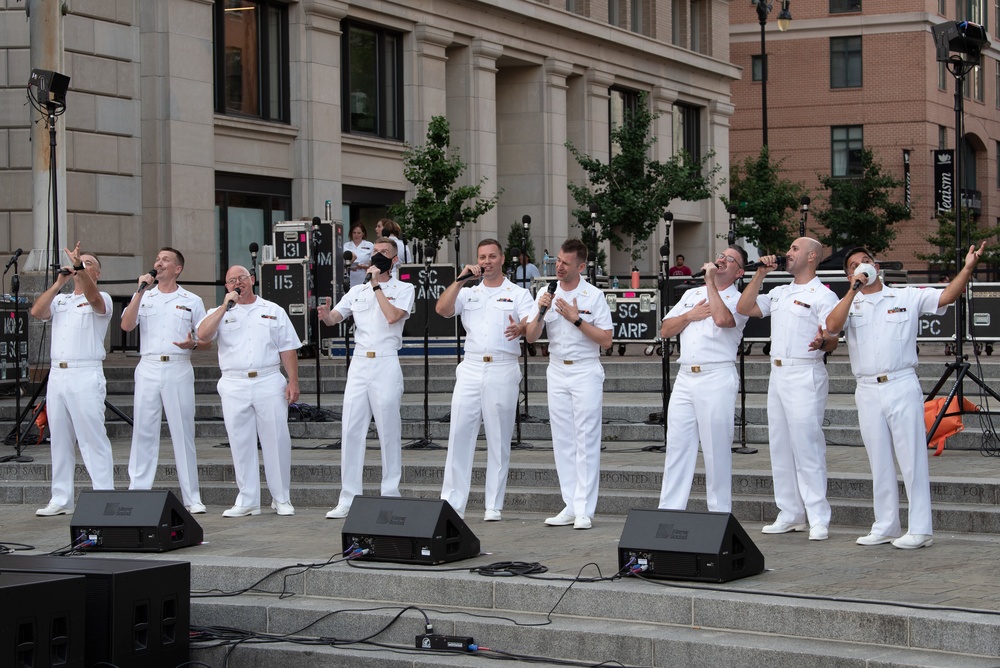 U.S. Navy Band Sea Chanters Chorus performs at the U.S. Navy Memorial Plaza