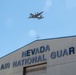 An Air National Guard C-130 Hercules flies over the hangar at Nevada Air National Guard base in Reno