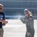 Champagne shower: Senior Master Sgt. Kathy Backlund is sprayed after her final flight &quot;fini-flight&quot; in the C-130 Hercules