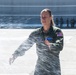 Champagne shower: Senior Master Sgt. Kathy Backlund is sprayed after her final flight &quot;fini-flight&quot;