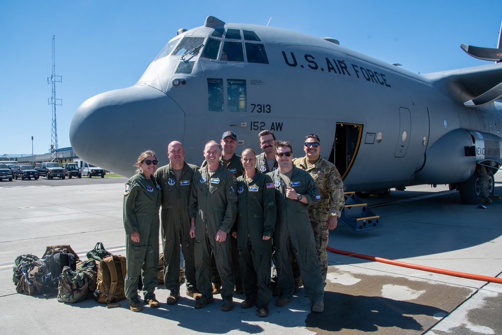 Fini-Flight Fun: Group shot of aircrew after Senior Master Sgt. Kathy Backlund's fini-flight
