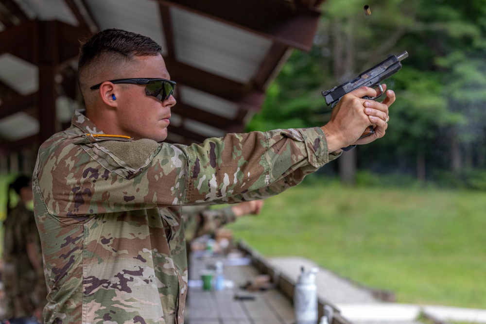 Cpl. Anton Shekhalevich fires a Colt 1911 pistol