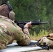 Col. Brent Dishman fires a M16 rifle