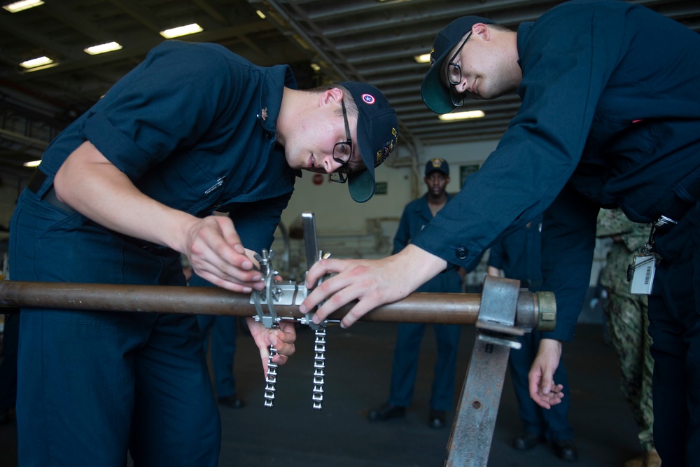 Sailors Practice DC Drills Onboard USS America