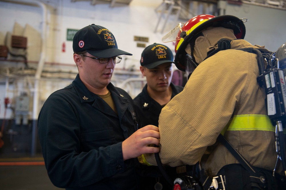 Sailors Practice DC Drills Onboard USS America