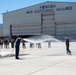 Fini-Flight Shower: Lt. Col. Charles Steffens, II is sprayed after completing his final flight &quot;Fini-Flight&quot; in the C-130 Hercules