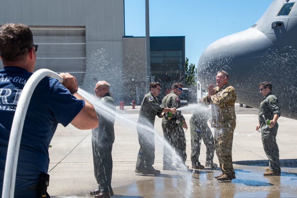 Fini-Flight Shower: Chief Master Sgt. Todd Houchens is sprayed after completing his final flight &quot;Fini-Flight&quot; in the C-130 Hercules