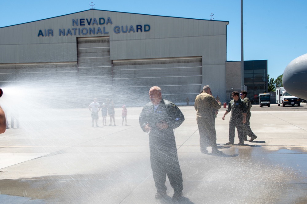 Fini-Flight Shower: Lt. Col. Charles Steffens, II is sprayed after completing his final flight &quot;Fini-Flight&quot; in the C-130 Hercules
