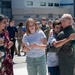 Lt. Col. Charles Steffens, II hugs his son after completing his final flight &quot;Fini-Flight&quot; in the C-130 Hercules