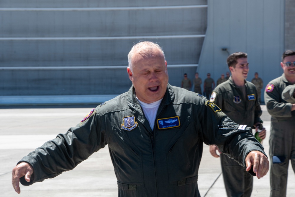 Fini-Flight: Lt. Col. Charles Steffens, II recovers from being sprayed after completing his final flight &quot;Fini-Flight&quot; in the C-130 Hercules