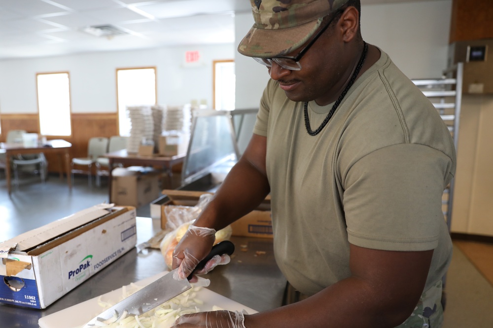 Culinary specialists prepares turkey dinner