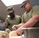 Culinary specialists prepares turkey dinner