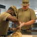 Culinary specialists prepares turkey dinner