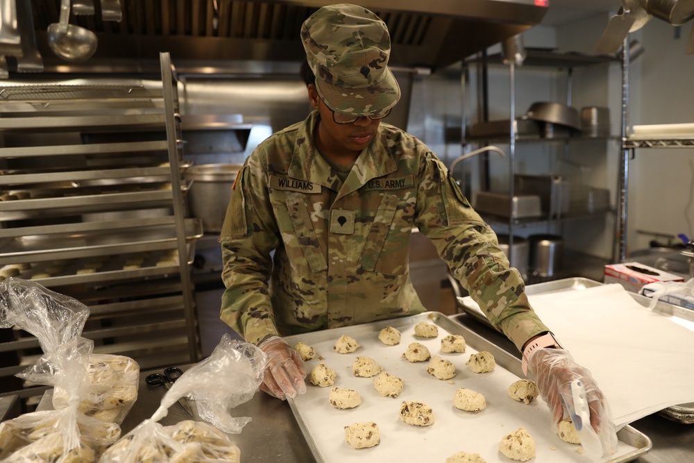 Culinary specialists prepares turkey dinner