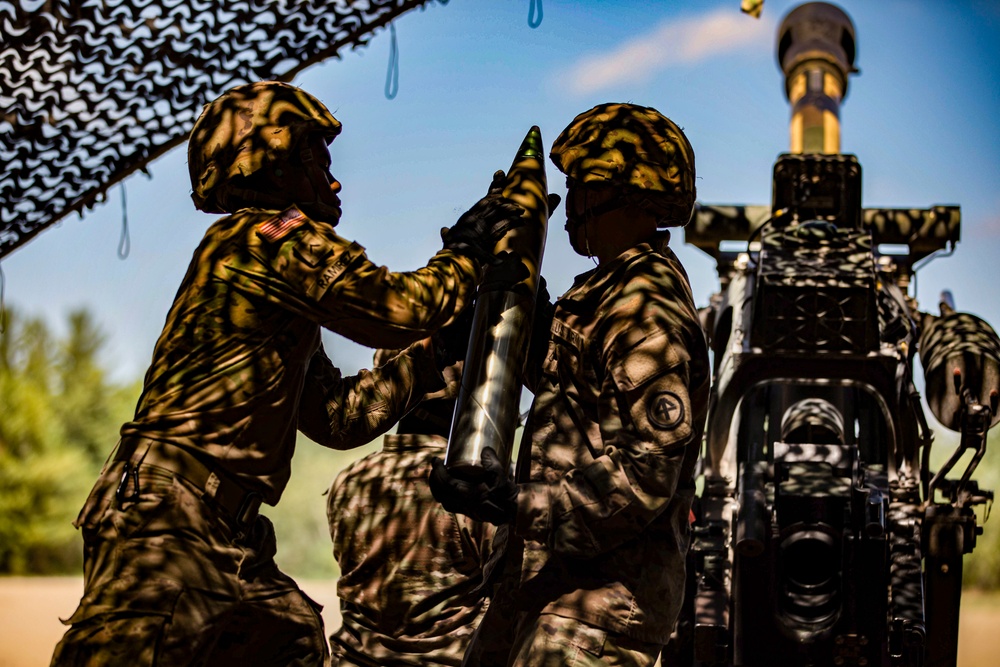 Soldiers of the 112th Field Artillery Regiment shoot 105mm Howitzers at XCTC