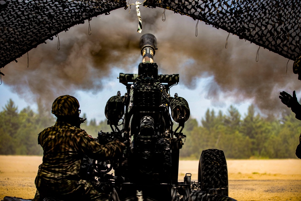 Soldiers of the 112th Field Artillery Regiment shoot 105mm Howitzers at XCTC