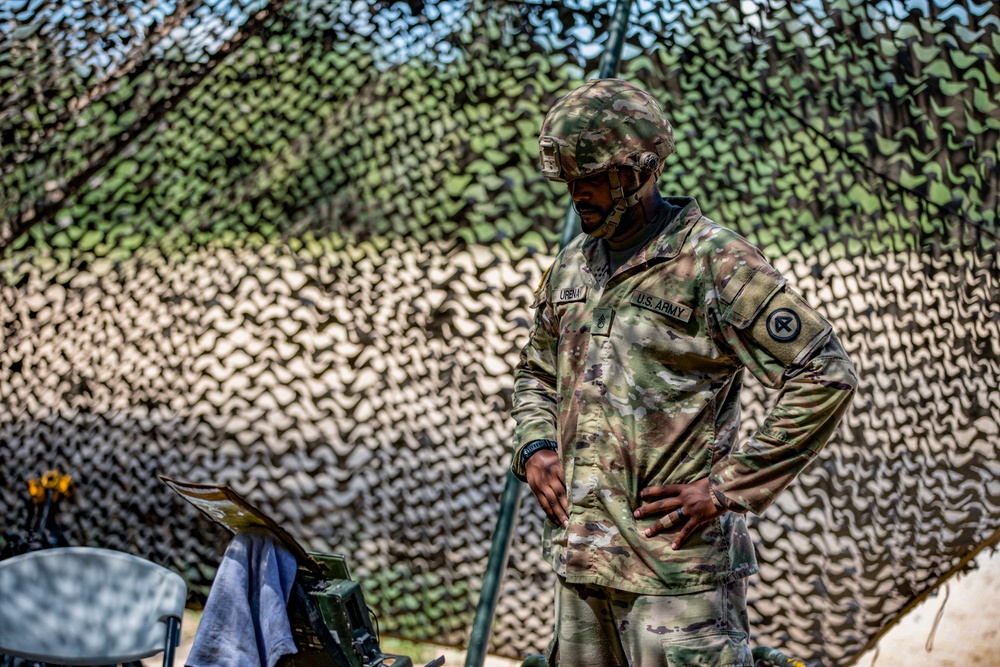 Soldiers of the 112th Field Artillery Regiment shoot 105mm Howitzers at XCTC