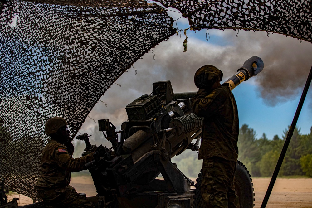 Soldiers of the 112th Field Artillery Regiment shoot 105mm Howitzers at XCTC