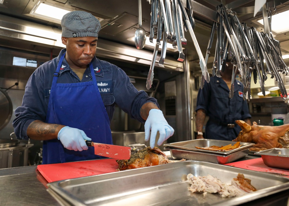 Culinary Specialist Cleans Grill