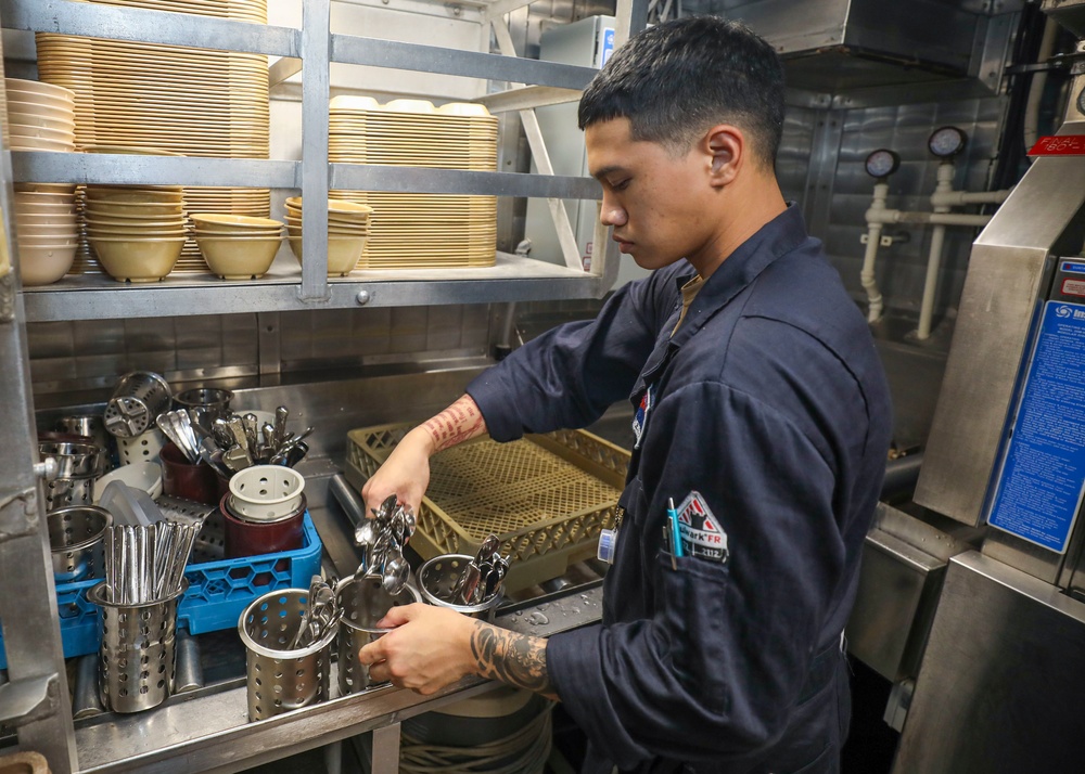 Food Service Assistant Cleans Cutlery