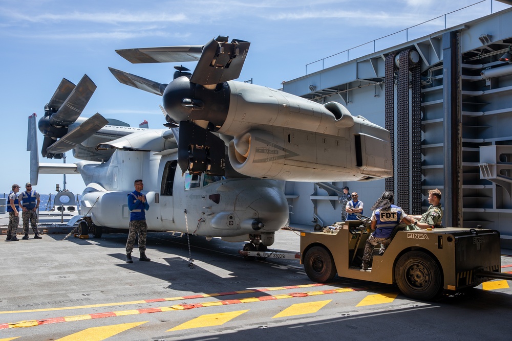 HMAS Canberra stows an Osprey for the first time at sea