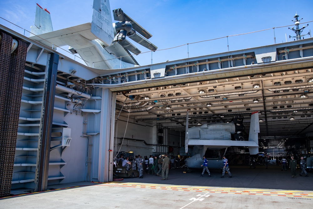 HMAS Canberra stows an Osprey for the first time at sea