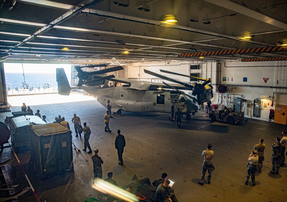 HMAS Canberra stows an Osprey for the first time at sea