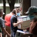 U.S. service members and Hondurans unload medical supplies at Hospitals Escuela, San Felipe