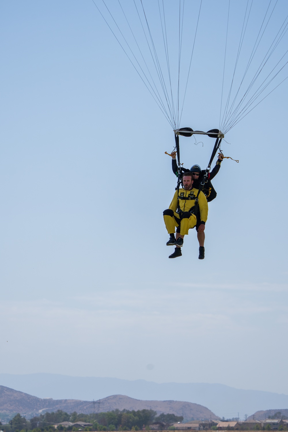 Soldier on U.S. Army Parachute Team takes actor Clive Standen on tandem skydive