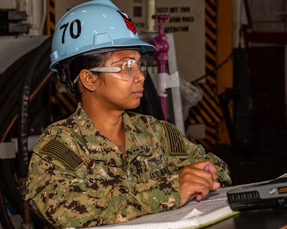 Sailor stands as Petty Officer of the Watch on USS Carl Vinson