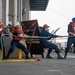 Sailors prepare the Hershel “Woody” Williams to get underway