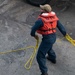 Sailors prepare the Hershel “Woody” Williams to get underway