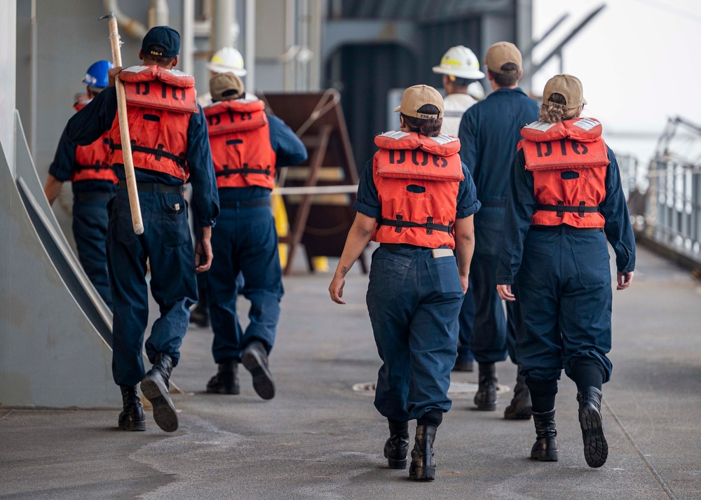 Sailors prepare the Hershel “Woody” Williams to get underway