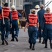 Sailors prepare the Hershel “Woody” Williams to get underway