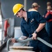 Sailors prepare the Hershel “Woody” Williams to get underway