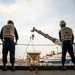 Sailors prepare the Hershel “Woody” Williams to get underway