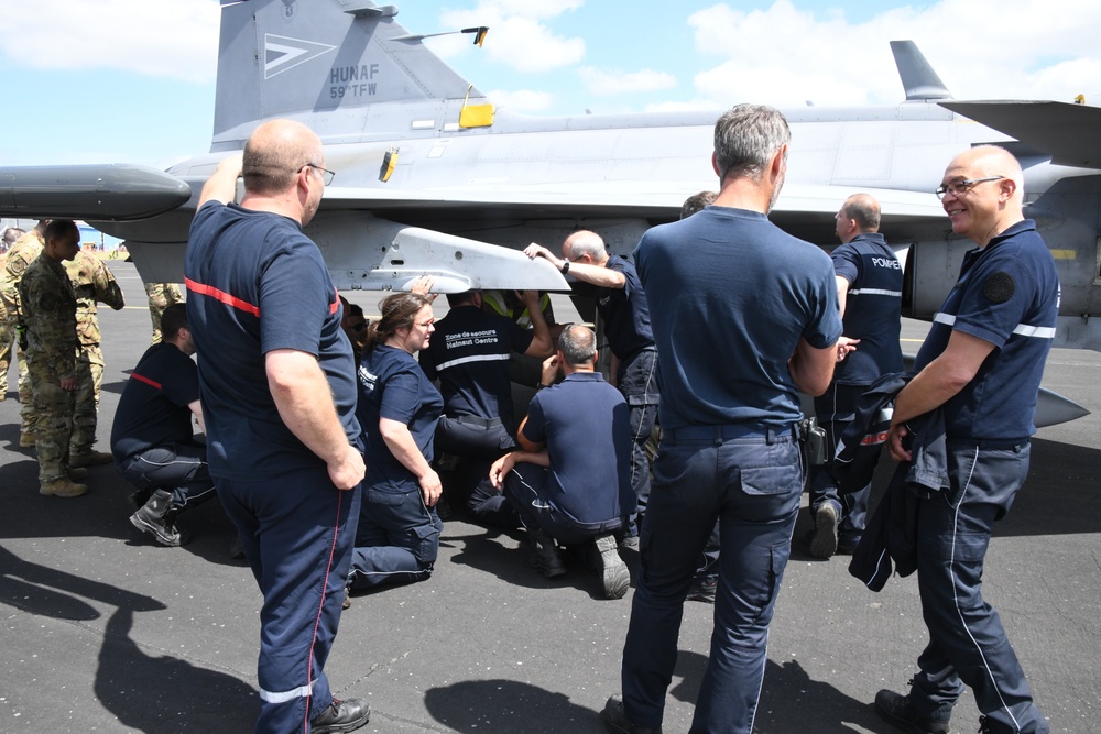 U.S Firefighters, 424th Air Base Squadron, train Belgian Host Nation Firemen to intervene on an aircraft, Chièvres Air Base, 23 June 2022.