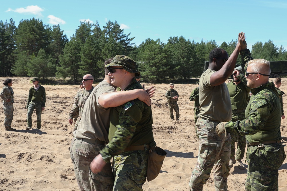 US, Canadian troops play tug of war