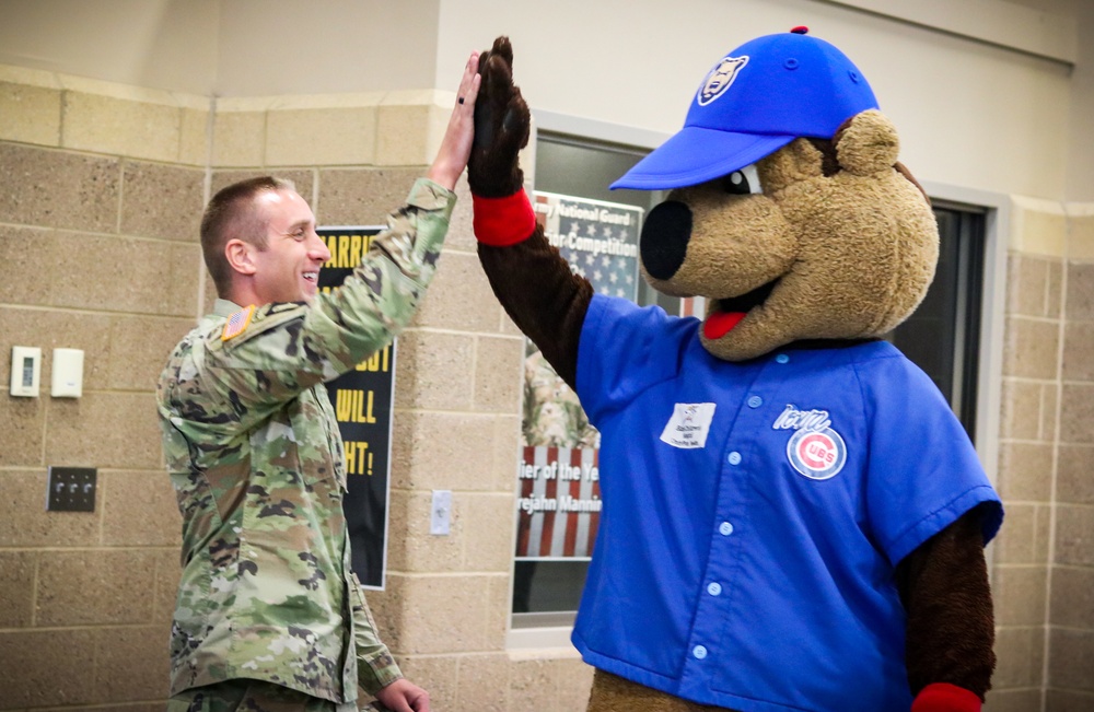 Iowa Soldier high-fives Cubbie Bear