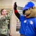 Iowa Soldier high-fives Cubbie Bear