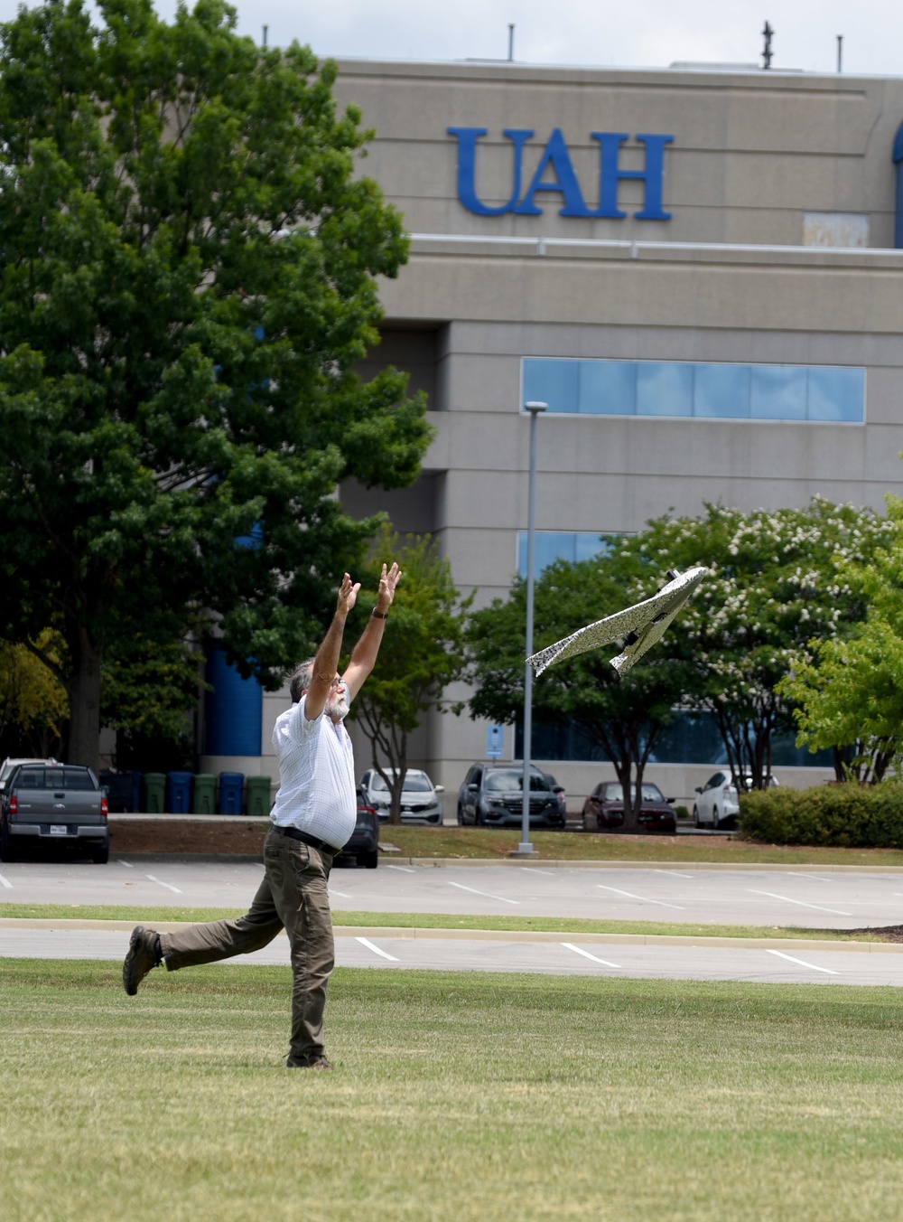Huntsville Center's George Wade releases a drone for a flight over the UAH campus.