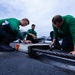 Abraham Lincoln Sailors conduct flight deck maintenance during RIMPAC 2022