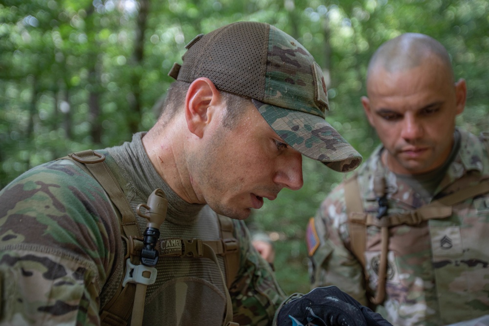 DVIDS - Images - Maj. James Fink checks his map [Image 3 of 4]