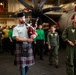 Royal Canadian Air Force Captain plays bagpipes aboard Abraham Lincoln during RIMPAC 2022