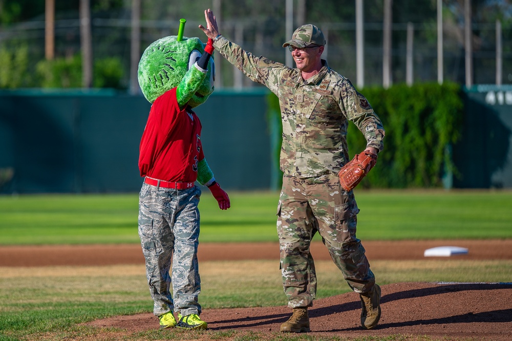 Malmstrom command chief throws Voyagers game first pitch