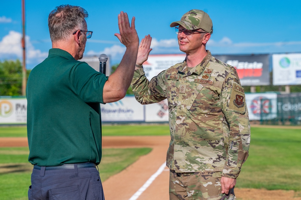 Malmstrom command chief throws Voyagers game first pitch