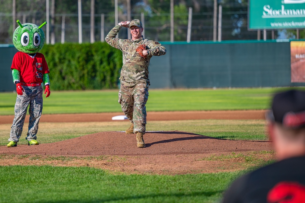 Malmstrom command chief throws Voyagers game first pitch