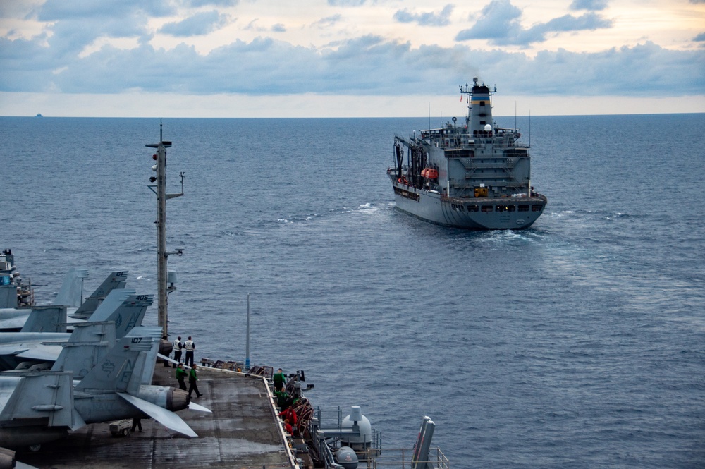 USS Ronald Reagan (CVN 76) conducts fueling-at-sea with USNS Tippecanoe (T-AO 199)