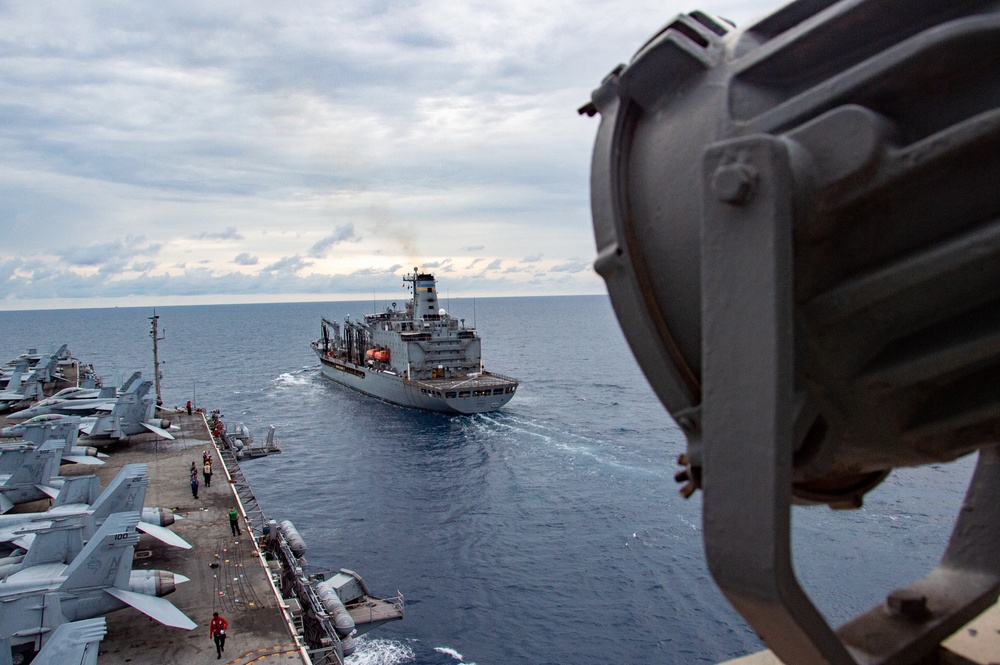 USS Ronald Reagan (CVN 76) conducts fueling-at-sea with USNS Tippecanoe (T-AO 199)